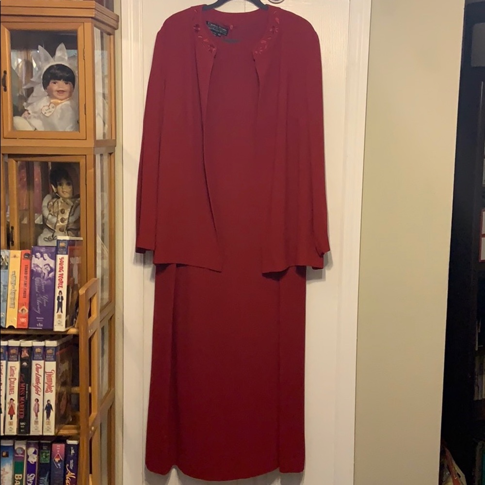 Red crepe like sheath dress with matching jacket.